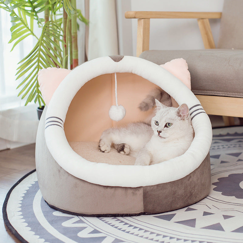 Cat relaxing in a cozy cat bed at home